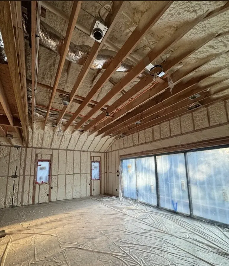 Interior walls and ceiling insulated with spray foam during new construction in Old Jamestown